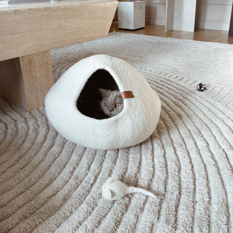 Image - Signature Kit featuring the Cassius Cat Cave, a cozy wool bed with a sleek design, and Milton Cat Toys, handcrafted from natural wool for playful fun.