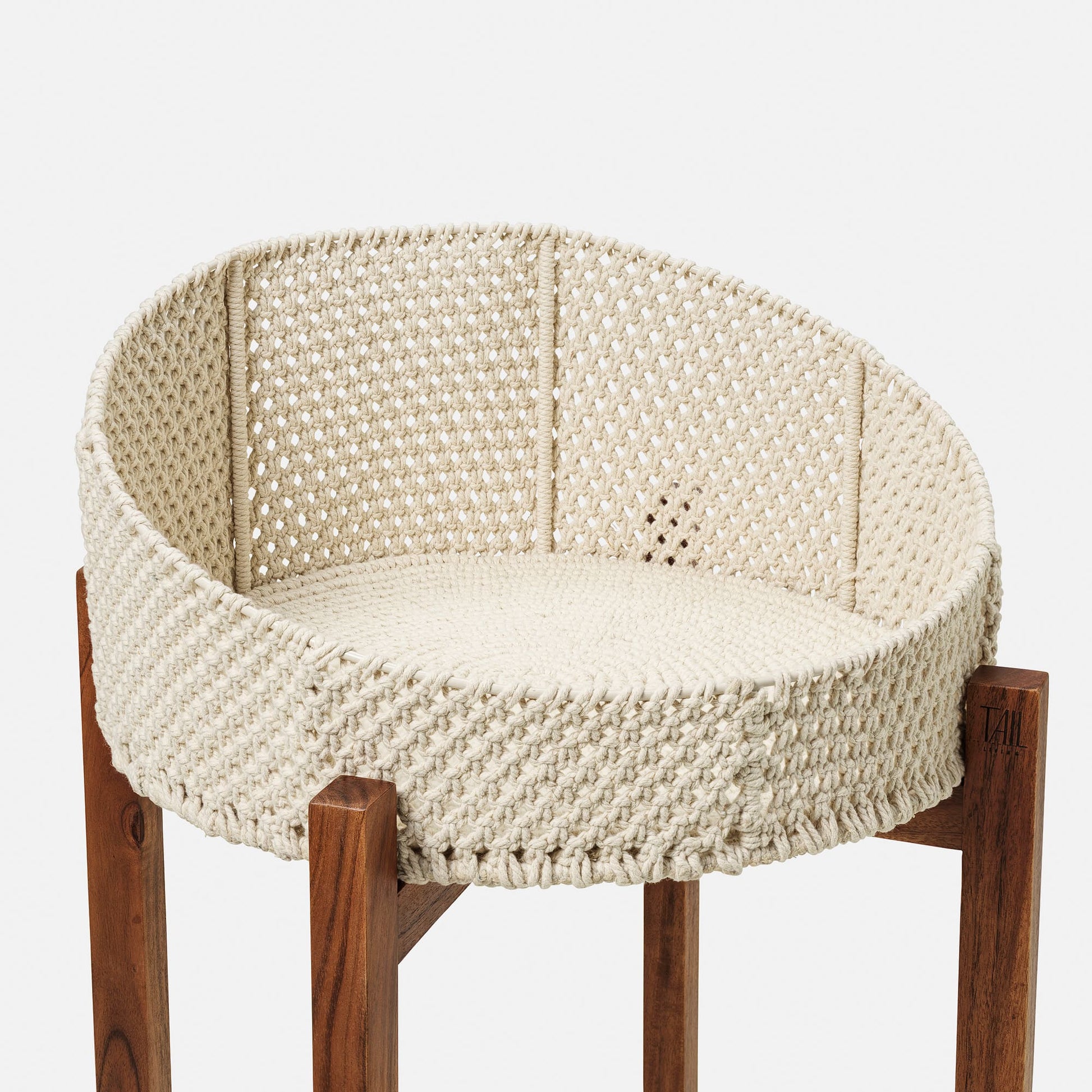 Image - Cat bed on wood legs with a white  crochet bed in a closeup