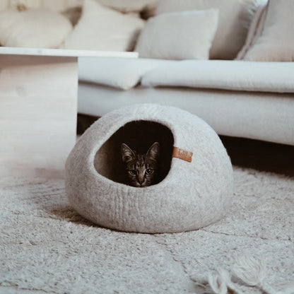Image - Greige cassius cat bed with a brown cat laying in it
